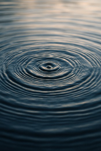 Close-up of soft ripples touching a shallow shelf near the bank