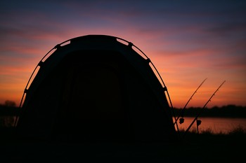 Bivvy front with chair, boots and net lined up neatly before dark